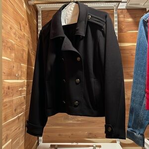 Universal standard double breasted military style jacket with silver buttons.